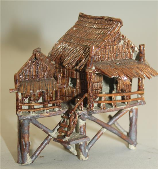 Ten Japanese stoneware models of houses, boats and bridges, early 20th century, tallest 9cm